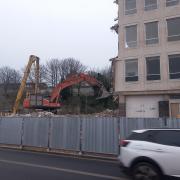 Excavators are making progress with tearing the building down