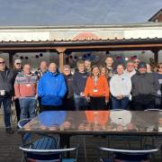Group photo of staff and service users at the Veterans Hub