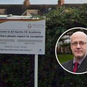All Saints CE Academy entrance with picture of Principal John Cornish
