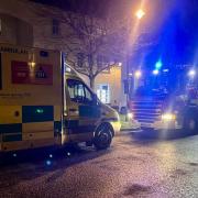 Woman rescued from flat fire