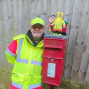 Jason alongside the Post box topper on Whitecross Drive