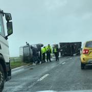A car and a caravan overturned on the A35