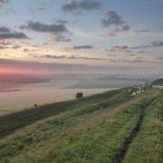 Maiden Castle, an Iron Age hillfort near Dorchester which will feature on one of the walks