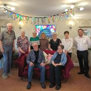 Residents are joined by lodge manager Adam Dicker (far right) for a photograph to mark the occasion