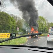 Dramatic picture shows car fire on main Dorset route