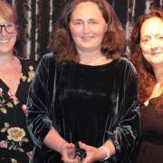 Dorset Council foster carer, Jo Wheeler (centre of image), collects the Pioneer award in recognition for her incredible work helping Dorset's children and young people.