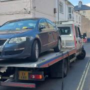 A 'suspicious' car had been blocking New Street in Weymouth and was seized by police officers