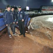 SOAKED: Chris Holder, Ludvig Lindgren and Neil Middleditch on track this evening