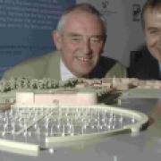 THAT WAS THEN: Borough councillor Geoff Petherick and Howard Holdings' Martin Jepson study a model of the Pavilion site scheme last October