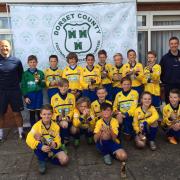 The Weymouth Cougars Under-11 squad with their coaches