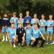 LEAGUE CUP WINNERS: The Weymouth under-15 squad show off their trophies
