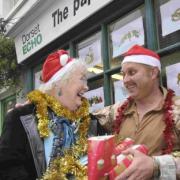 CHRISTMAS SPIRIT: Support Our Soldiers appeal organiser Molly Rennie with Territorial Army Sergeant Nigel Scott