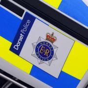 Dorset Police is investigating racial and anti-Semitic slurs graffitied in Dorchester.