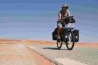 PEDAL POWER: Peter Gostelow cycling through the Sahara on his charity bike ride from Dorset to Cape Town, South Africa