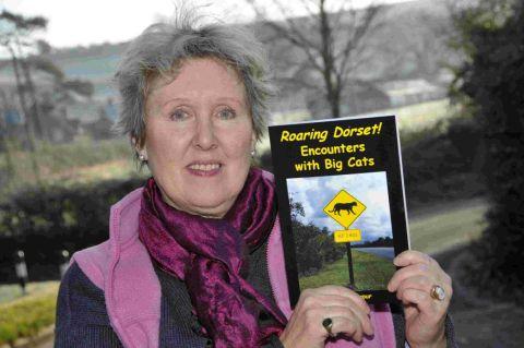 EXPERT: Author Merrily Harpur with her book on big cat sightings in Dorset