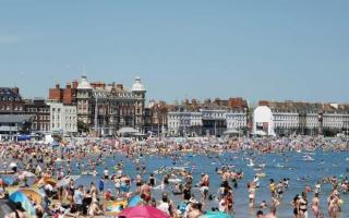 Visitors soak up the sun on Weymouth Beach in 2021 Picture: Graham Hunt Photography