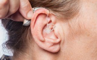 Hearing aid worn by woman