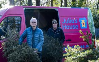 Julia's House volunteers collecting Christmas trees for recycling