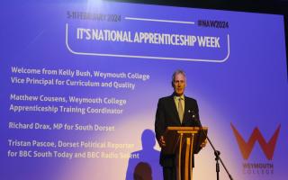 Richard Drax MP on stage at the celebration lunch at Weymouth College