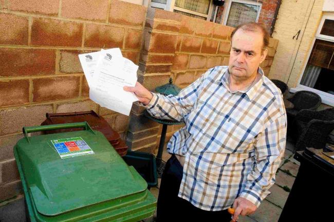 THREAT: Guy Poingdestre with letters from Dorset Waste Partnership