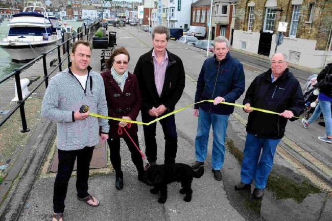 OBJECTION: From left, Dave Taylor (Chatsworth Hotel), Renia Sladen (Bedford Guest House), Andrew Brown, John Kelly and Mike Thomas who are objecting to the shipping container cafe plan on Custom House Quay, Weymouth